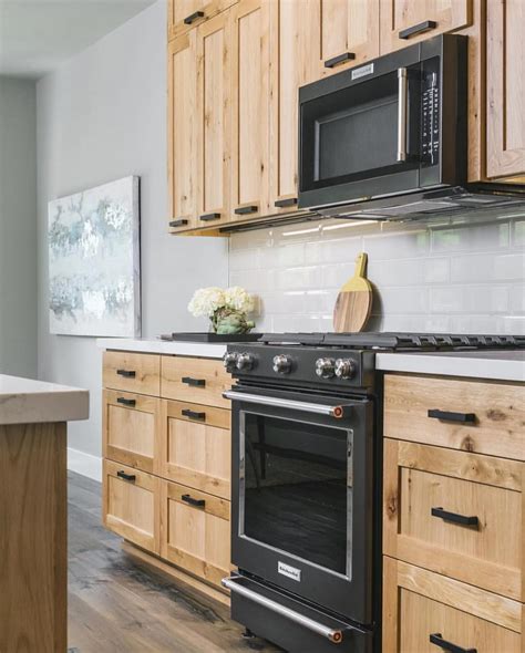 black stainless steel appliances with light wood cabinets|cabinet colors with black appliances.